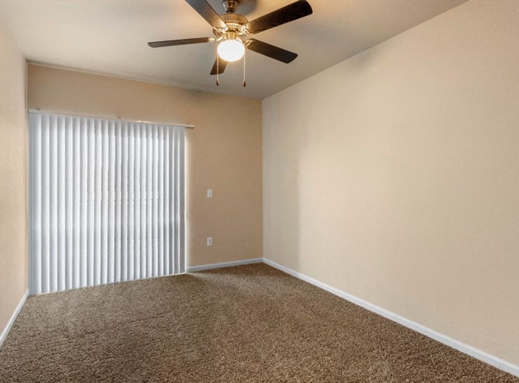 Living room with wall to wall carpet and ceiling fan